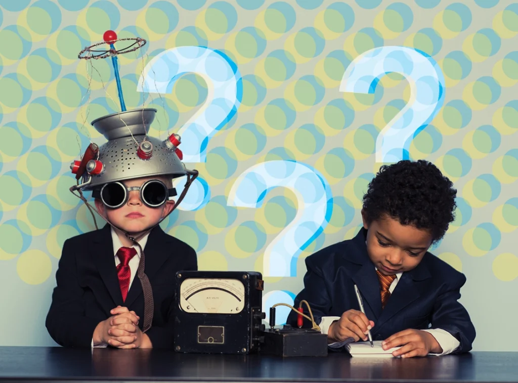 Two young students dressed as scientists exploring complex ideas with experimental equipment and question marks in the background.